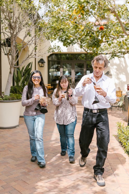 Young teen girl with Intellictual Disablities walking around with her respite family.