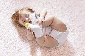 Sweet baby playing with feet